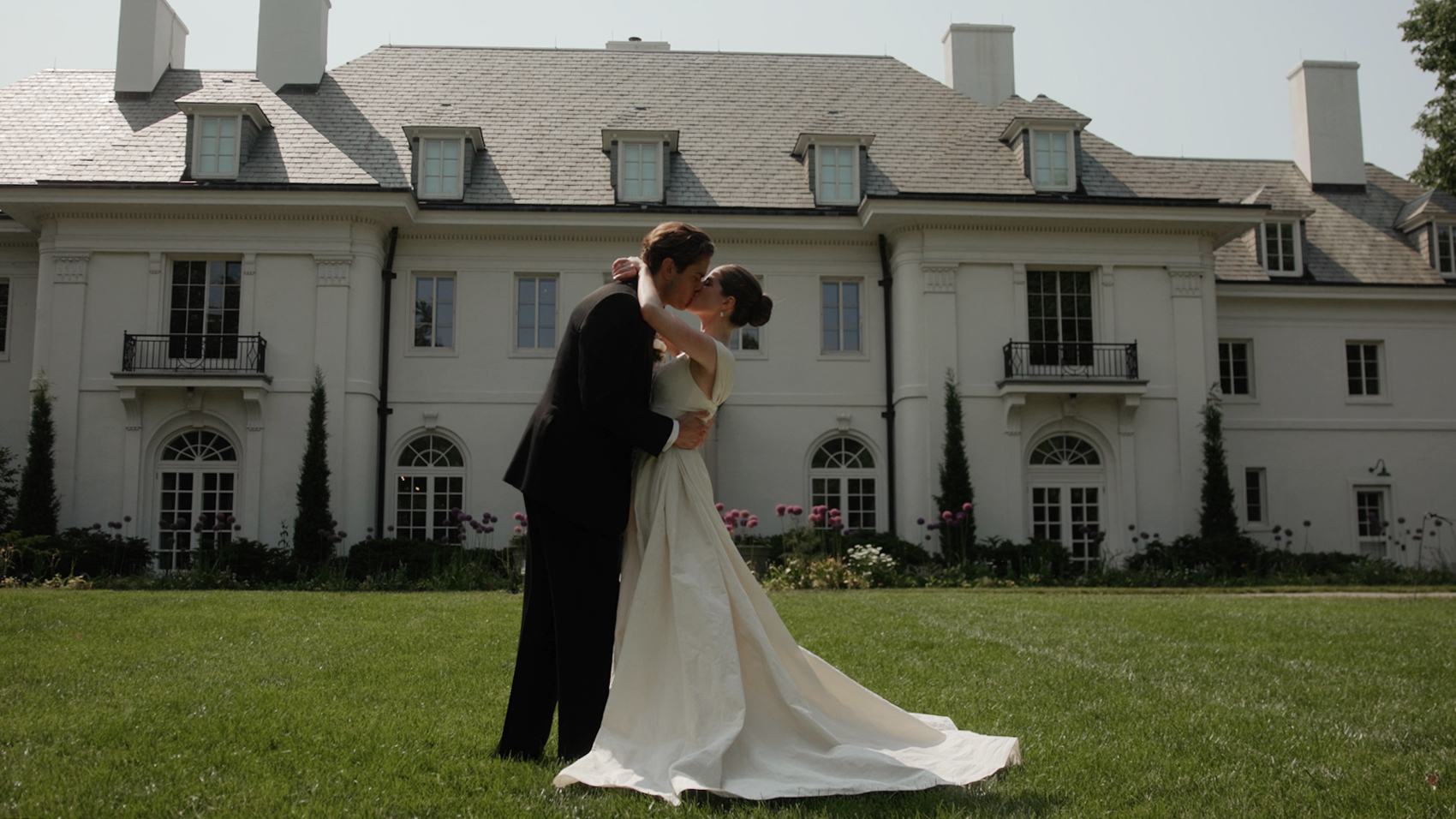 Couple portrait in front of the Lily House at Newfields